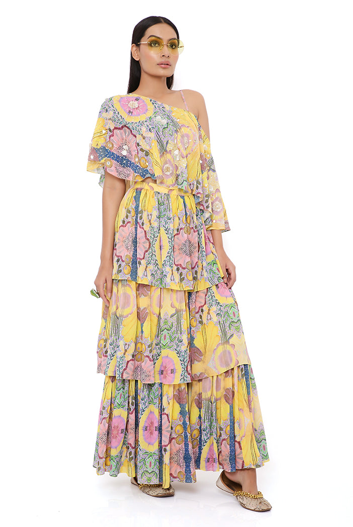 YELLOW ENCHANTED PRINT GEORGETTE EMBROIDERED ONE SHOULDER CAPE WITH BUSTIER AND FRILL SHARARA